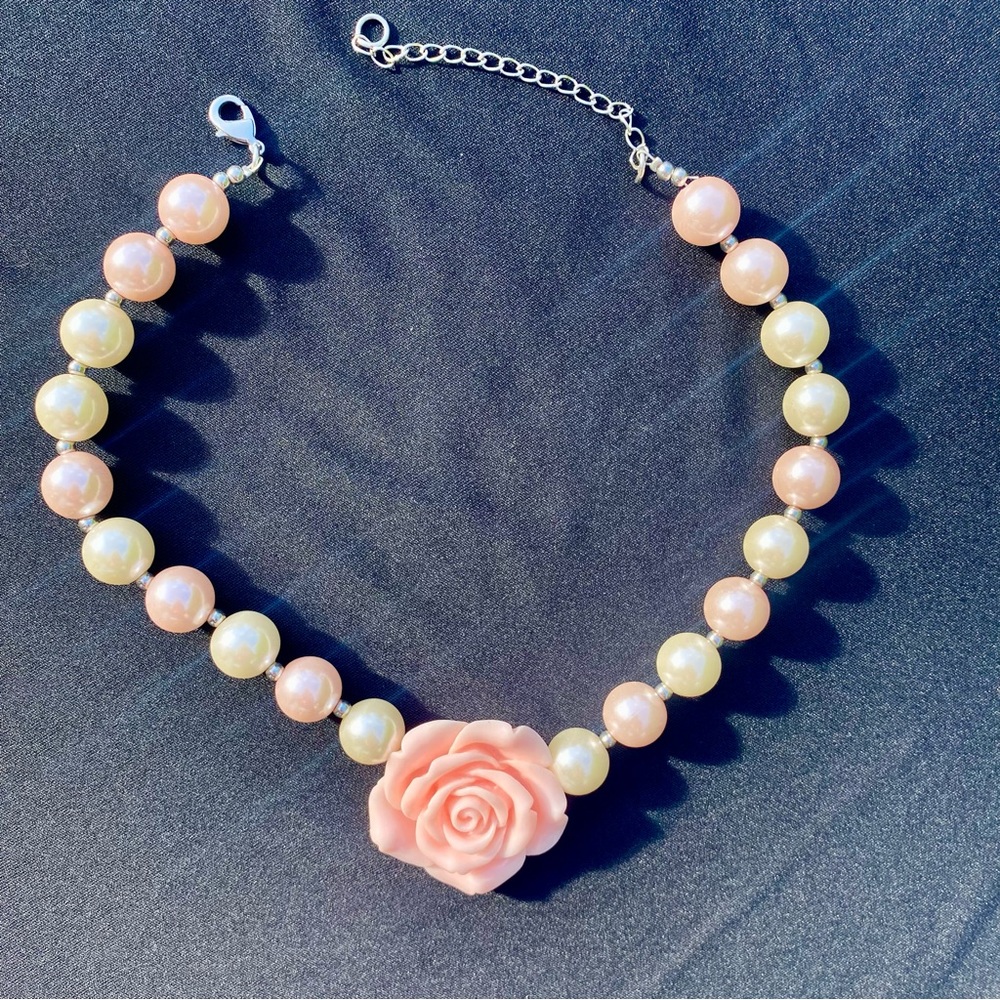 Girl’s pearl necklace with light pink flower.Excellent condition,worn once.